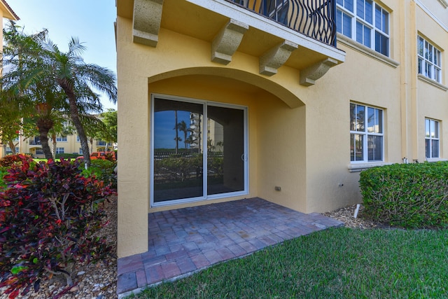 doorway to property with a patio