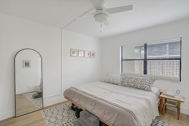 bedroom featuring light wood-type flooring and ceiling fan