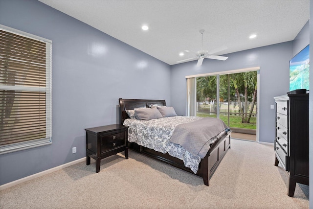 carpeted bedroom with access to outside, multiple windows, ceiling fan, and a textured ceiling