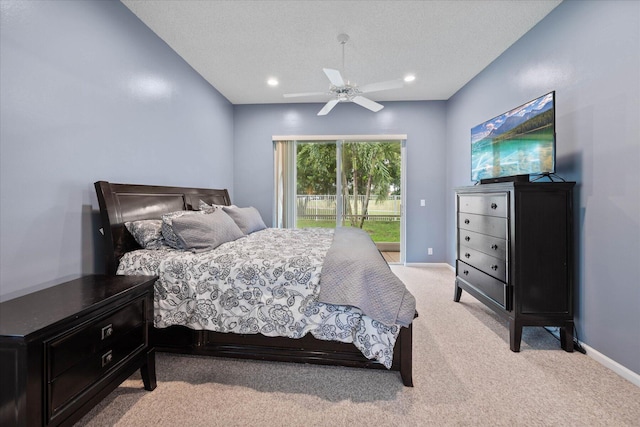 carpeted bedroom with access to exterior, ceiling fan, and a textured ceiling