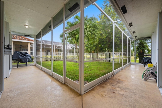 unfurnished sunroom with a wealth of natural light