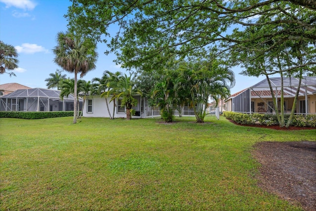 view of yard with a lanai