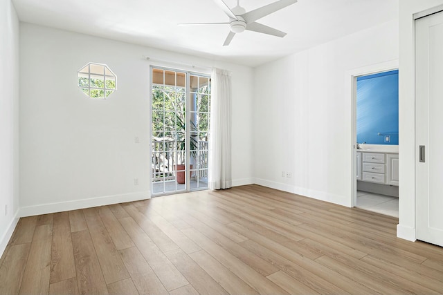 empty room featuring ceiling fan and light hardwood / wood-style floors