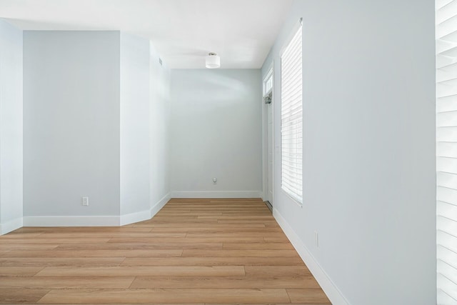 spare room featuring light hardwood / wood-style flooring