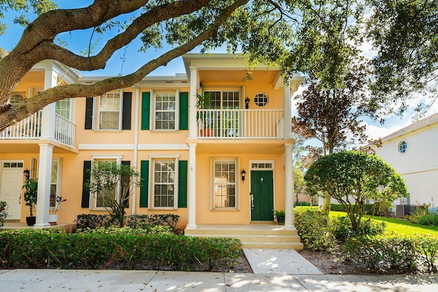 entrance to property with a balcony