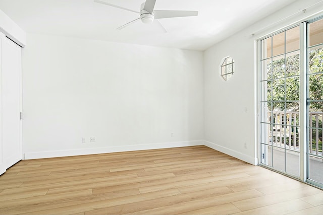 empty room with light wood-type flooring and ceiling fan