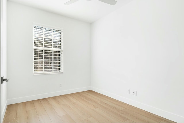 empty room with hardwood / wood-style flooring and ceiling fan