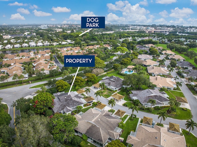 birds eye view of property with a residential view