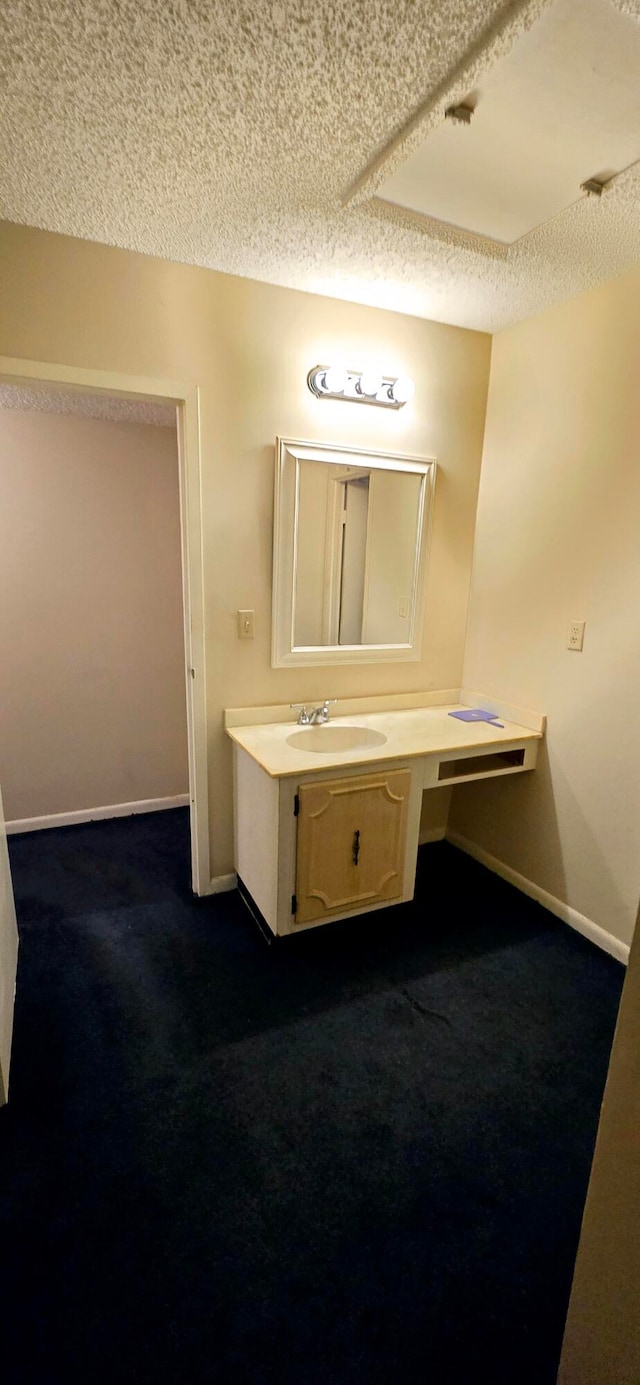 bathroom featuring vanity and a textured ceiling