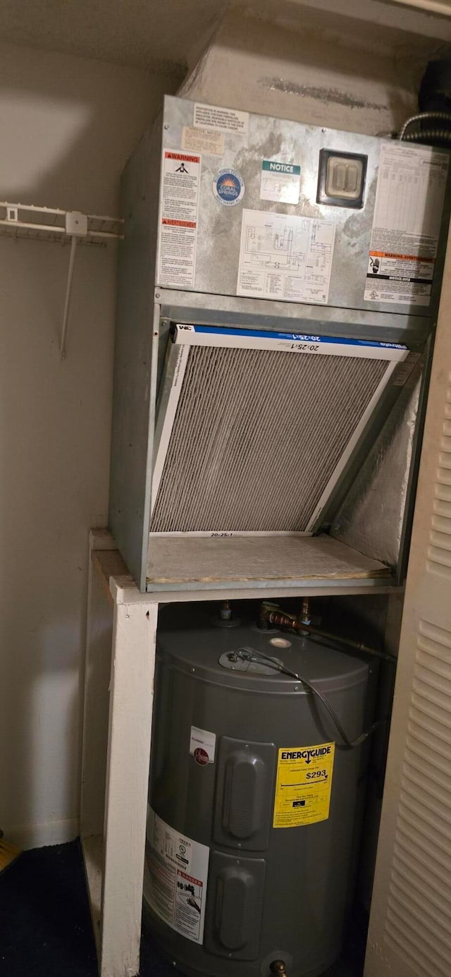 utility room with water heater