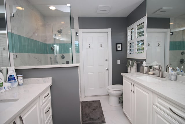 bathroom featuring vanity, toilet, and walk in shower