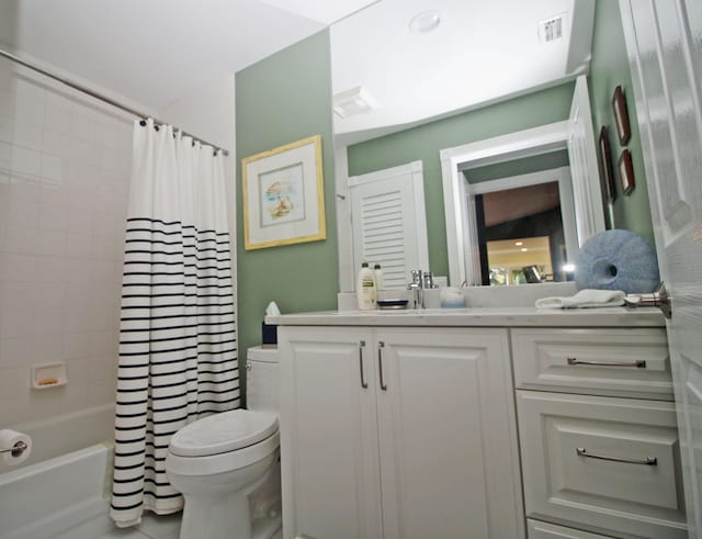 full bathroom with vanity, toilet, and shower / tub combo