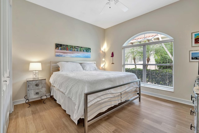 bedroom featuring a closet, ceiling fan, and light hardwood / wood-style flooring