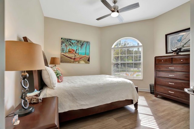 bedroom featuring ceiling fan and light hardwood / wood-style flooring