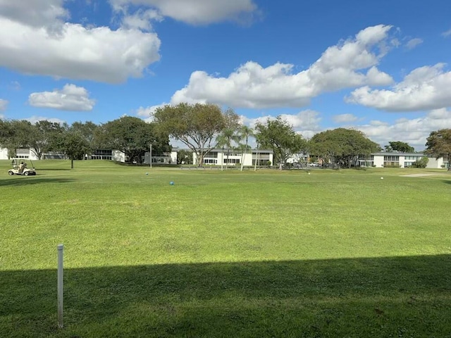 surrounding community with a lawn