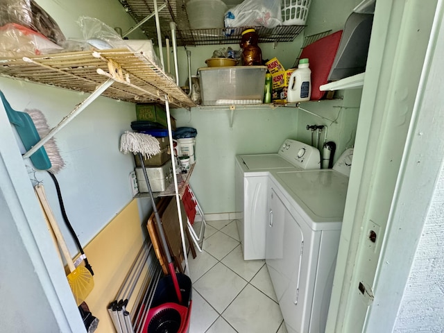 543 Flanders L, Delray Beach, FL 33484 - laundry room featuring separate washer and dryer and light tile patterned floors