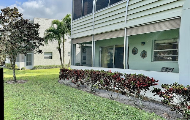 view of home's exterior with a yard