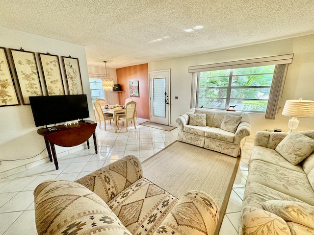 tiled living room featuring a textured ceiling