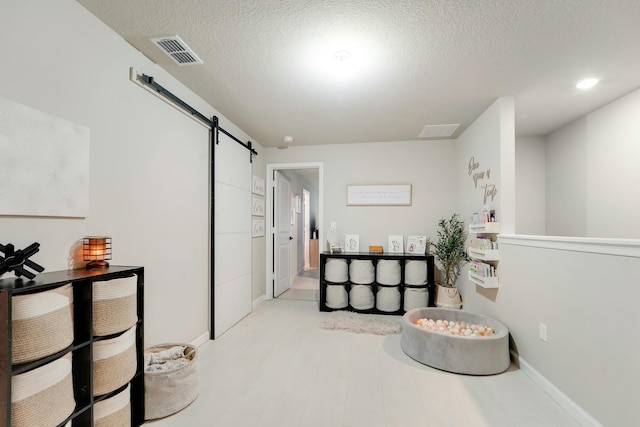 bedroom featuring a textured ceiling