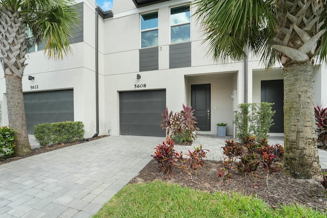 doorway to property with a garage