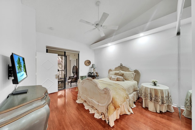 bedroom featuring ceiling fan, lofted ceiling, and hardwood / wood-style flooring