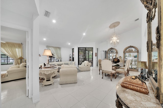 living room with light tile patterned floors and a notable chandelier