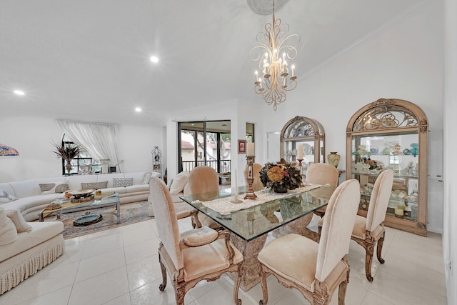 dining space featuring a chandelier, vaulted ceiling, crown molding, and light tile patterned flooring