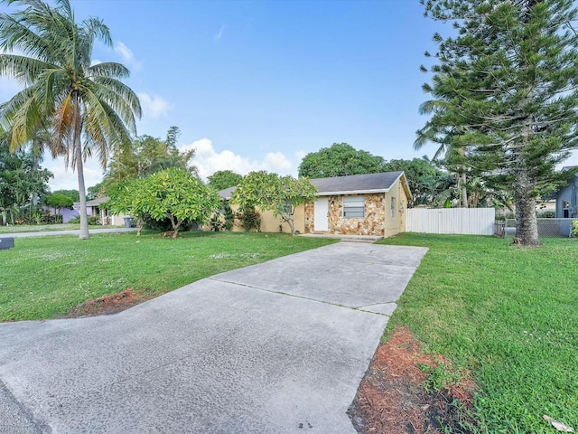 3561 Oberon Ave, Boynton Beach, FL 33436 - view of front of property with concrete driveway, stone siding, and stucco siding