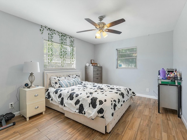 bedroom featuring light hardwood / wood-style floors and ceiling fan