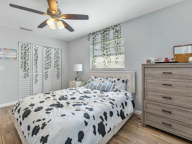 3561 Oberon Ave, Boynton Beach, FL 33436 - bedroom with light wood-style floors, baseboards, a closet, and a ceiling fan