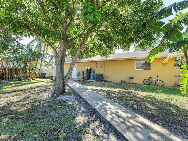 rear view of house with central AC unit