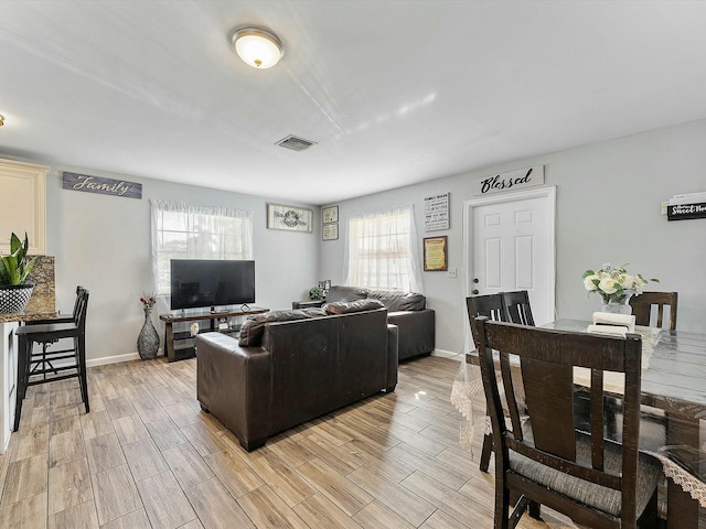 living room with light hardwood / wood-style floors