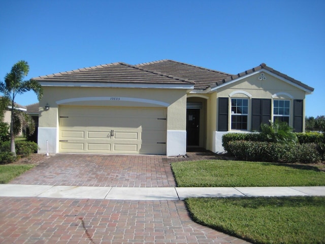 ranch-style home featuring a garage