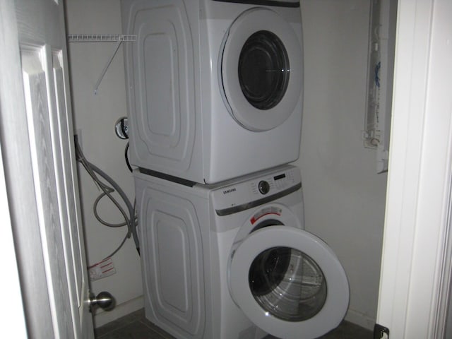 washroom with stacked washer / dryer