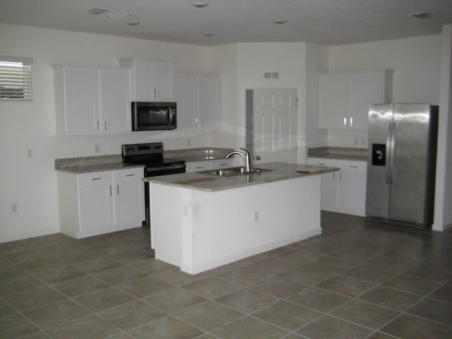 kitchen featuring white cabinetry, sink, an island with sink, and appliances with stainless steel finishes