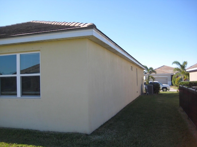 view of side of home featuring a yard