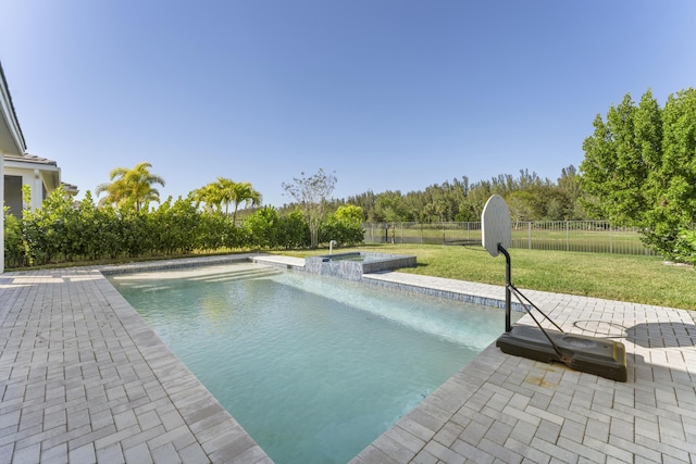 view of pool with a patio area and a yard