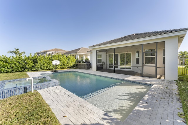 view of pool with ceiling fan and a patio