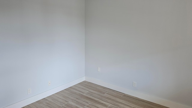 unfurnished room featuring light hardwood / wood-style flooring