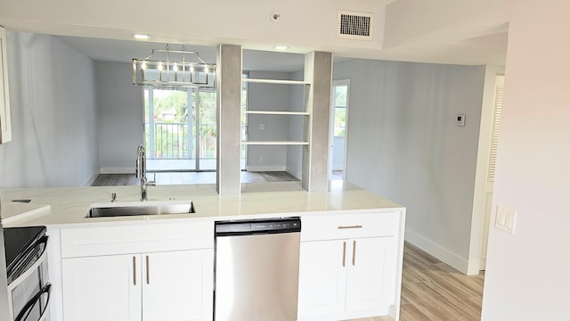 kitchen with dishwasher, light hardwood / wood-style floors, white cabinets, and sink