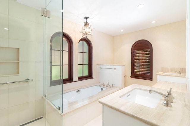 bathroom with vanity, tile patterned floors, and independent shower and bath