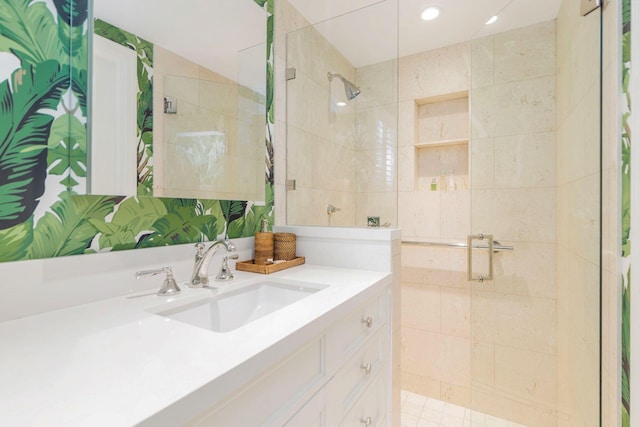 bathroom with vanity and an enclosed shower