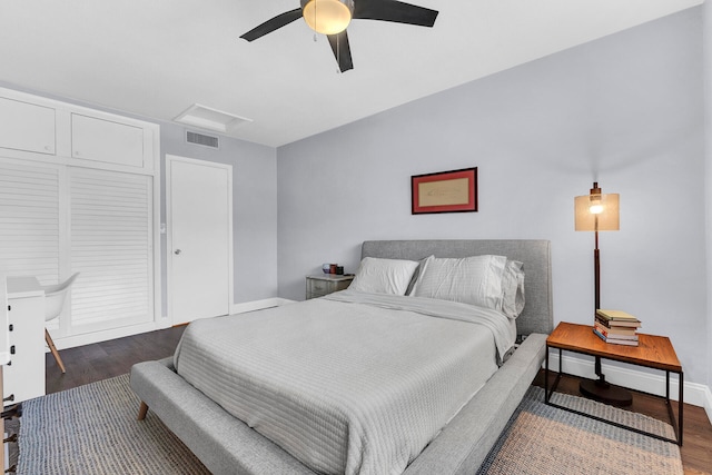 bedroom featuring dark hardwood / wood-style flooring and ceiling fan