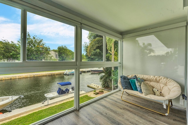 sunroom / solarium with a water view