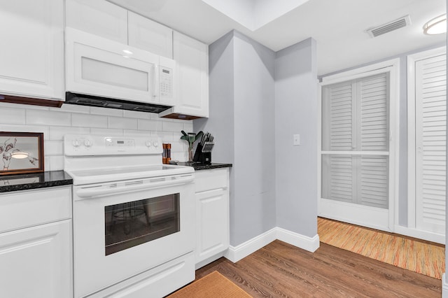 kitchen featuring backsplash, white cabinetry, white appliances, and hardwood / wood-style flooring