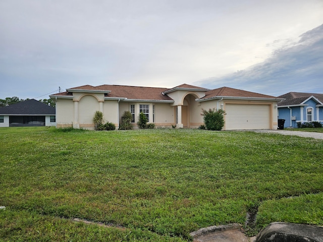 view of front of house featuring a front yard and a garage