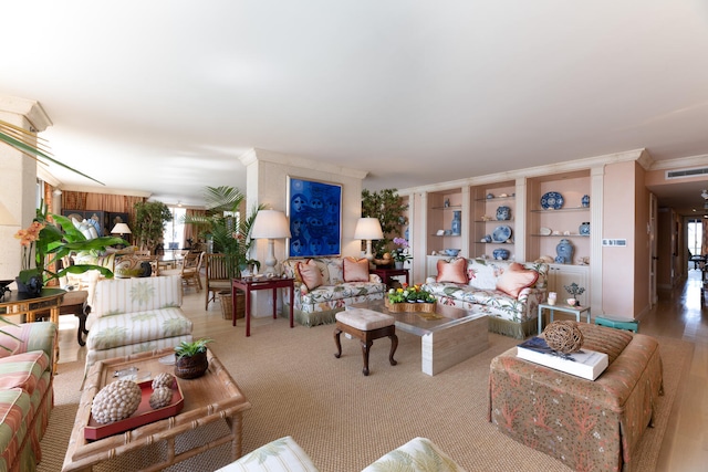 living room featuring a wealth of natural light and crown molding