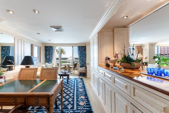 kitchen featuring wooden counters, light wood-type flooring, and crown molding