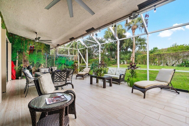 view of patio / terrace featuring a lanai, an outdoor hangout area, and ceiling fan