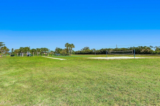 view of yard featuring volleyball court